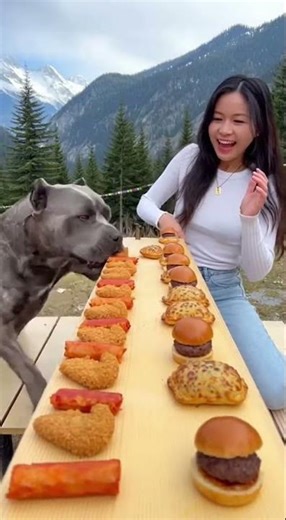 girl and dog eating food