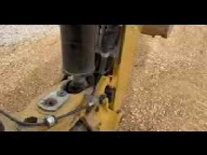Backhoe boom lock