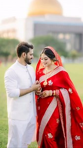 Enchanting Bride Makeover by Farhana Tinni A quiet celebration of love, grace, and simplicity. Wrapped in a classic red saree, she carries elegance without effort. No heavy sparkle, no loud colors — just a soft glow that feels pure and heartfelt. A mosque wedding holds a special kind of peace, where blessings feel closer and moments become timeless. Her look speaks of calm confidence, gentle happiness, and a heart full of serenity. Every detail is soft, warm, and beautifully minimal — just the w