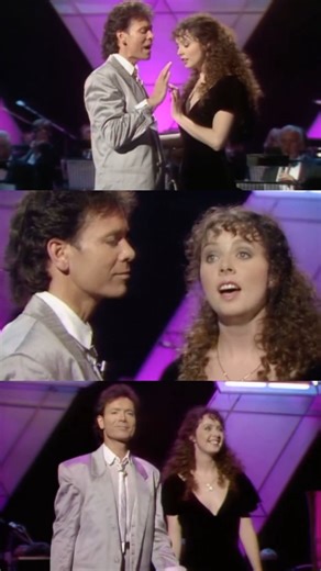 This week in 1986, Sarah released the beloved single “All I Ask of You” with Sir Cliff Richard. Taken from The Phantom of the Opera, this timeless duet captured hearts around the world and became a chart success, reaching the UK Top 3. ⭐️ That same year, Sarah and Cliff brought the song to life on the television programme Wogan, delivering a heartfelt performance that introduced the duet to millions of viewers at home. The moment has since become part of musical history, and was even revisited d