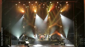 Colorful Stage lights at concert. Stage lights and smoke. Colored lights on an empty concert stage with smoke.
