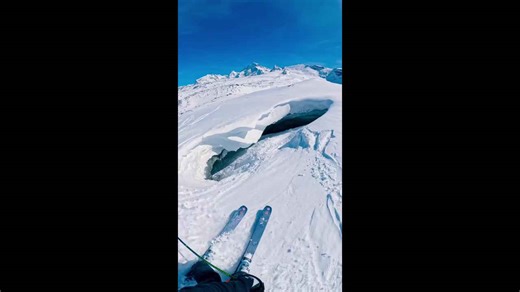 Extreme ski descent into glacier cave in Zermatt, Switzerland