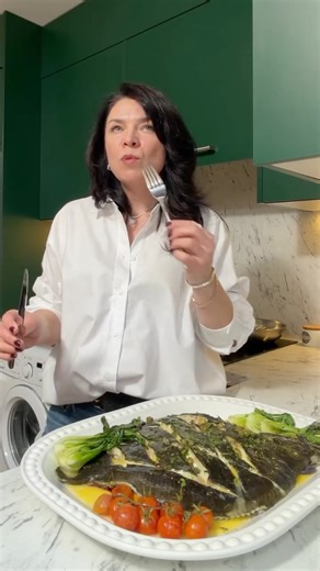 Nataliia Krasyliuk on Instagram: "How to cook whole fish in the oven | Tender baked turbot recipe 🐟 Whole turbot baked on lemon, onion and tomatoes, finished with a warm butter sauce made with white wine, lemon juice and capers. Juicy white fish with a delicate texture and clean seafood flavour. An elegant seafood dinner made at home.#dinneridea #comfortfood #fishrecipe #wholefish #whitefish"