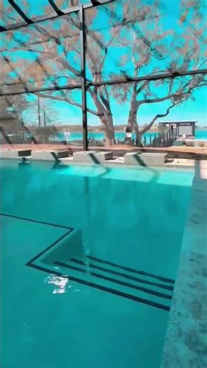 This custom pool deck features expertly installed pavers,, safety, and a clean, modern finish.