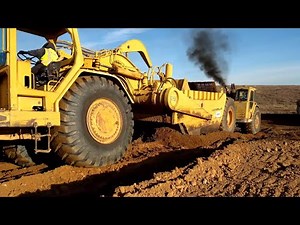 CAT 637E and 651B Scrapers push pulling - D8T Dozer using rippers