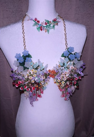 Every bead, every stitch tells a story in our handmade beaded bralette. Crafted with love and patience, this exquisite piece features intricate flower details that blooms symbolizing growth, beauty, and the delicate balance of nature. Each bead is carefully placed by skilled hands, ensuring that every curve and petal shines with timeless elegance. Wearing this bralette isn't just about fashion—it's about embracing artistry and the passion behind every handwoven thread. Let the soft, floral beaut
