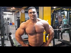 Iranian muscle king Behrooz Tabani posing in the gym