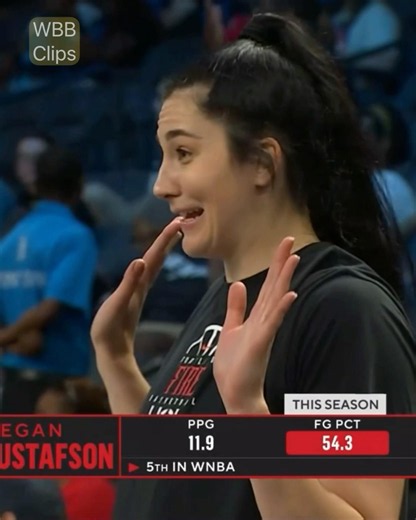 Megan Gustafson flashing spirit fingers ahead of the game