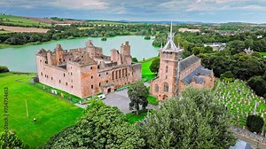 Aerial view of Linlithgow Palace, the ruins of medieval birthplace of Mary Queen of Scots. Scottish Tourist attraction on a low hill above a small inland loch in Scotland.