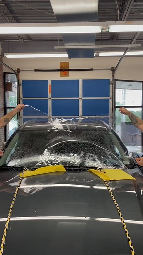 Exterior windshield protection film 💪🏼 This film protects your glass against rock pits and chips. We have a very high clarity windshield tint here. This is not easy to install. It is 4 mil thick PET. It is a slow process but it can be done. Who likes the way we rigged the wipers away from the glass? 💪🏼😎🤑🤑🤑 Follow us for more satisfying videos and tips and trick on window tinting and ppf. I will give a review of this product after a few weeks of wear and tear on the road. We added a ceram