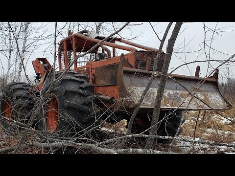 Logging with the Timberjack 230 Setting Chokers and Pulling Skids