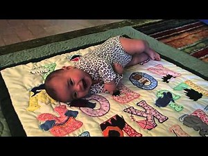 Baby Learning to Roll from Back to Stomach