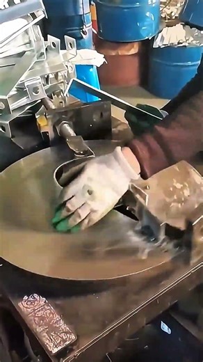 Metal spins, patterns carved with steady precision