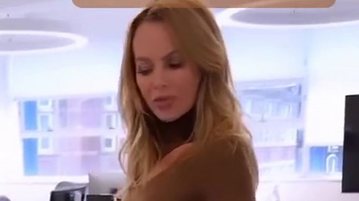 Amanda Holden shows off her legs in thigh-high boots and figure hugging dress