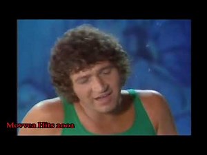 Mac Davis – Baby Don’t Get Hooked On Me (Music Video)