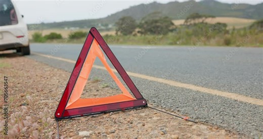 Road, triangle and car breakdown for shape, sign or vehicle assistance in the outdoor countryside. Asphalt, street or sidewalk safety symbol for warning, signal or traffic control to alert attention