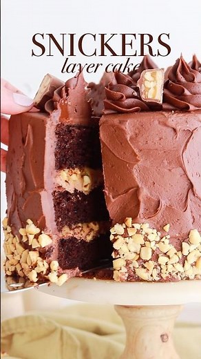 This Snickers cake with nougat + peanut caramel filling is my fave flavor thus far! #cake #snickers