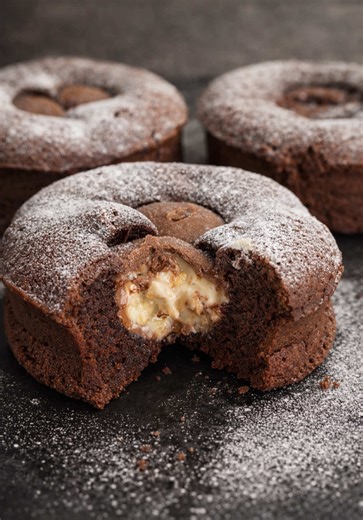 Gooey Lava Cakes 🧁 🌋 Break the center and it floods out like warm candy cream. This is childhood nostalgia melting in real time. This one tastes like sneaking chocolate before dinner and getting away with it. Crispy outside, molten Kinder center, pure comfort in one bite. Homemade, easy recipe, and honestly the best excuse to eat dessert straight from the oven. If heaven had a snack bar, this would be it. Ingredients • 60 g dark chocolate (about 2 oz) • 60 g butter (¼ cup) • 1 egg • 1 egg yolk