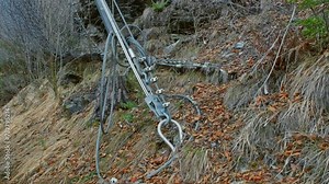 Rockslide Prevention Rockfall Safety Netting Supported by Metal Steel Wire Cable Anchored in Ground of Mountain Hill Slope Stock Video