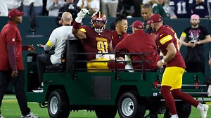 Commanders defensive end Deatrich Wise Jr. carted off the field with right quad injury vs. Packers