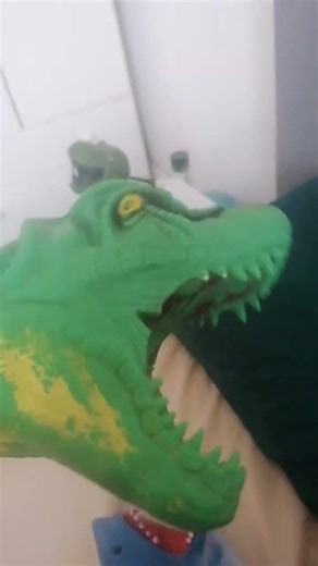 shark puppet throws dinosaur puppet in the closet