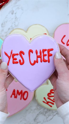 Is there anything more classic than a conversation heart for Valentine's Day? ❤️✨ Whip up the Wilton version featuring a surprise inside: https://bit.ly/ConversationHeartCookies | Wilton Cake Decorating