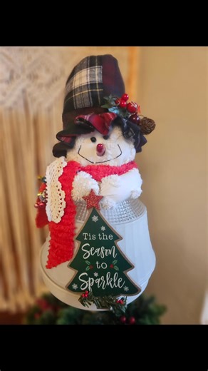 (SOLD) Found this old light fixture cover and couldn't resist repurposing it into a snowman. Mr. Sparkle is embellished with a chenille scarf with a touch of crochet and some jingle bells and a patchwork flannel hat tops it off. A battery operated candle illuminates him - i mean it tis the season to sparkle. He is about 15 inches tall and the globe is 8 inches in diameter. $18.00. Not sure where he is headed. Holler if you want him! Fyi... this is what happens when I decide to take a break from 