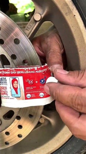 Motorcycle disc lock with toothpaste wrapper #ideas