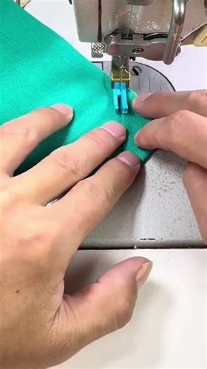 the process of sewing a piece of cloth at the end in a triangular shape using a sewing machine
