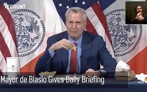 Mayor ⁩Bill de Blasio eats a burger and fries during today's press conference to announce free fries with vaccination promotion | VINnews