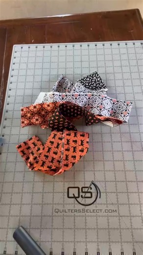 Quick table runner using 2 1/2” inch strips of 6 fabrics. Moda’s Midnight Magic is what I used. I also used Creative Grids Spiderweb Quilt Ruler and The Warm Company Fusible Fleece. It’s definitely not perfect, but I’m happy with the results! Video by thedesperatequilter #fabricstash #quiltersoftiktok #quiltingismytherapy #halloweenfabric #quiltersgonnaquilt | Sharon Green