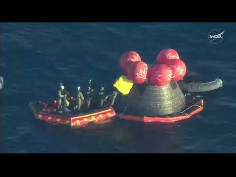 Rescue team works to extract Artemis II mission crew members from capsule