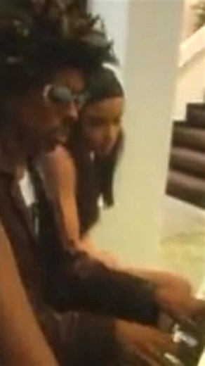 Shock G plays Tupac on grand piano