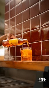 We crafted Aframisia's rich amber hue to mirror the South African sky at dusk. It’s more than a colour; it's the signal to stop, breathe, and enjoy the complex flavour of the perfect sunset companion. Unwind button, pressed. Available at select retailers. | Aframisia