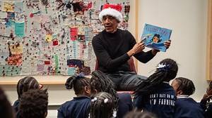 ‘Santa’ Obama surprises Chicago elementary students with storytime visit
