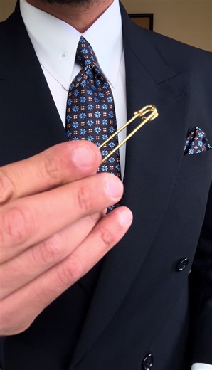 Stylish Accessories: White Shirt, Gold Collar Pin & More