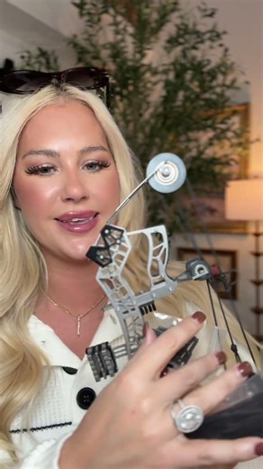 This mini bow is so fun — it’s stainless steel, shoots real little arrows, and feels like a legit