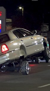 Cadillac & Lincoln Town Car LOWRIDERS hopping and cruising in 3 wheel motion, with an LAPD Police Car right behind them! 🤯 | Skid Society