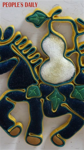 Traditional Chinese knotted buttons in the form of eight horses are sewn meticulously with elaborate designs by Liu Dongmei, an inheritor of the intangible cultural heritage in Rizhao, east China's Shandong Province. | People's Daily, China