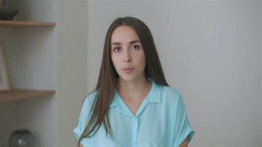 Head shot portrait woman looking at camera makes video call. Woman in front of a computer team working in video conference | Premium Stock Video Footage