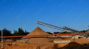 Sand production.Sand quarry. Equipment for sand extraction in a sand quarry in a pine forest. 4k footage