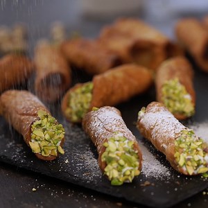 Cannoli Siciliani - crispy pastry tubes filled with a flavorful ricotta filling and dipped in chopped crunchy pistachios. Full recipe: https://bit.ly/2P54Tej | Home Cooking Adventure