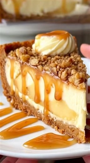 🍪 Apple Crisp Cheesecake | Cozy Fall Layers in Every Creamy Bite 🍎 This apple crisp cheesecake is the kind of dessert that feels like a warm hug. Creamy, rich cheesecake layered with tender cinnamon apples, a buttery crumb crust, and that irresistible crisp topping — finished with a drizzle of caramel that makes every bite extra special. Yield: 12 generous slices Ingredients: Crust: 2 cups graham cracker crumbs ½ cup unsalted butter, melted 2 tablespoons granulated sugar Apple filling: 3 large