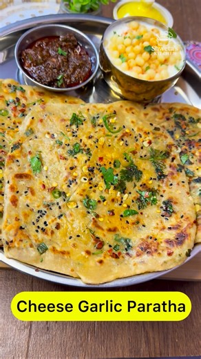 Shweta's Kitchen | Cheesy, garlicky and absolutely irresistible! 🤤 This Cheese Garlic Paratha is a perfect fusion of Indian paratha and cheesy flavors. Loaded... | Instagram