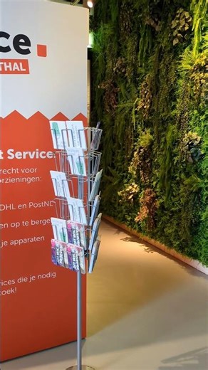 Free cute postcards and green leaves picture wall at Markthal, Rotterdam