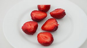 Strawberry slices on a plate - Free Stock Video