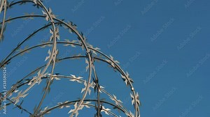 Barbed wire fencing. Border wall between countries. Barbed wire fencing around a prison. Conflict between countries.