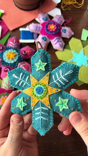 Felt snowflake stitching! ❄️ The colors on this one plus the stars made the vibe a little “under the sea” but it’s still super cute. #modernembroidery #fiberart #embroideryart #handstitched #dmcembroidery #michiganartist #bordados #feltart #ornaments #christmas