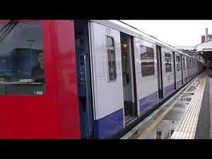 London Underground D Stock 7021 and 7504 departing Wimbledon
