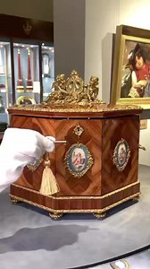 Notable for its incredible marquetry case and beautifully embellished Baccarat crystal, this handsome 19th-century cave à liqueur consists of three decanters and 16 cordial glasses. Mounted with superb Sèvres or Sèvres-style porcelain plaques and topped by ormolu winged putti, the case opens to reveal another porcelain plaque decorating the lid’s interior and a stunning gilt glass drinking set.View more details on our website. Item No. 31-6596#msrau #antiques #baccarat #sevres #porcelain #liqueu